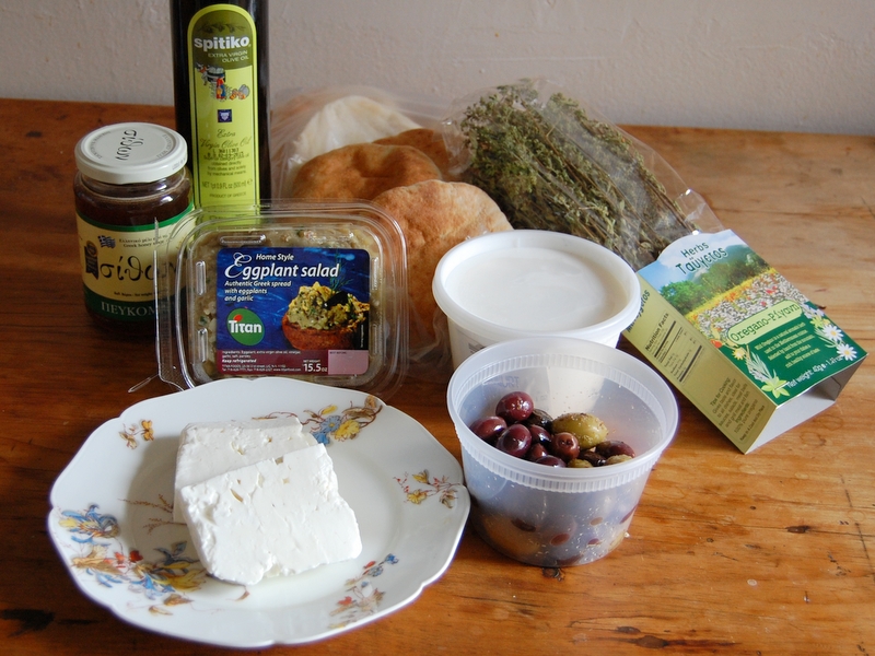 The spread: dark honey, olive oil, eggplant salad, pita, wild oregano, yogurt, olives and feta.